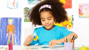 Child focused on coloring a picture_