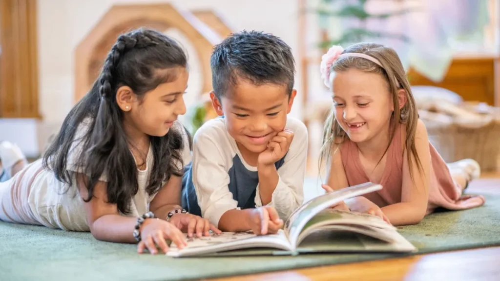 kids reading a book together
