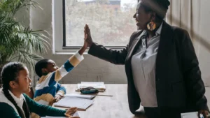 Teacher and student high five