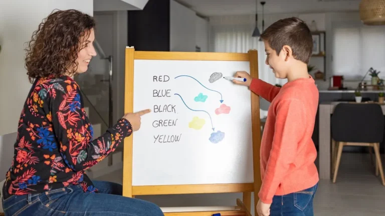 Teacher helping a child connect words_